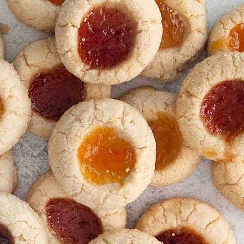 Image of thumbprint cookies with different jams on top of each